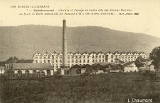 Remiremont - Filature et Tissage de Coton dits des Grands Moulins. Au fond, la Forêt domaniale du Fossard (700 à 800 mètres d'altitude)